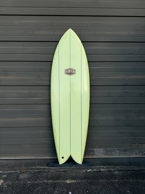 green triple stringer fish surfboard