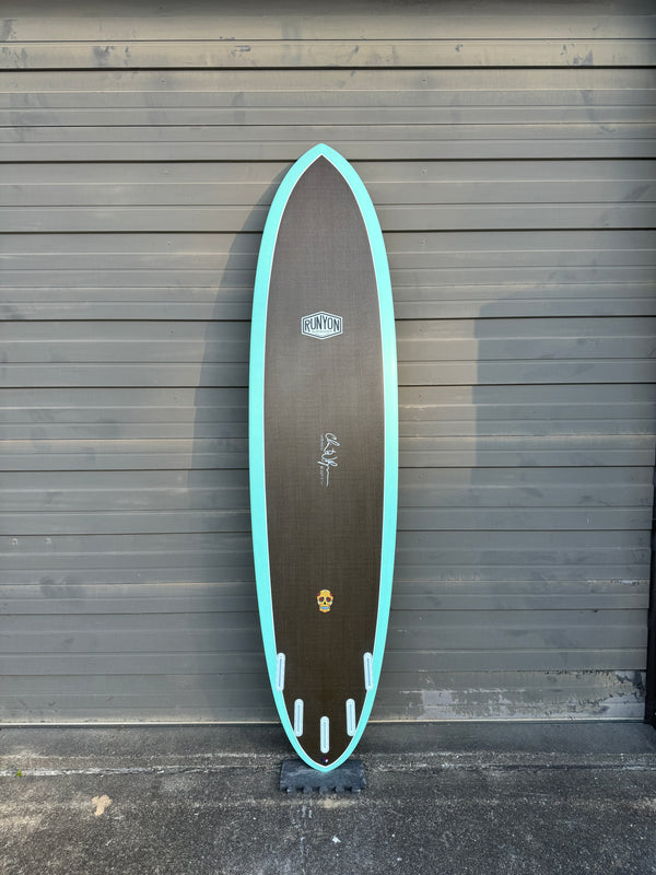 black and blue mid length 5 fin surfboard