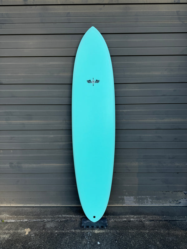 blue mid length surfboard