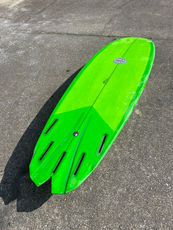 green 5 fin surfboard shortboard