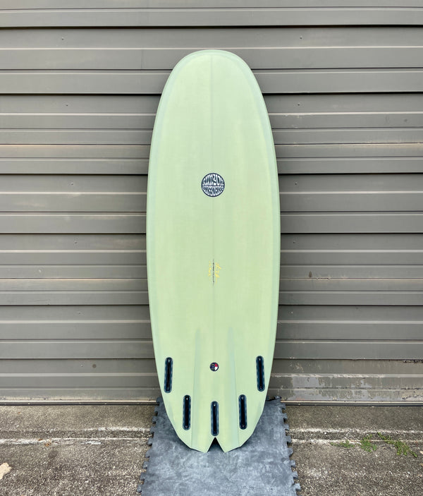 green 5 fin shortboard surfboard