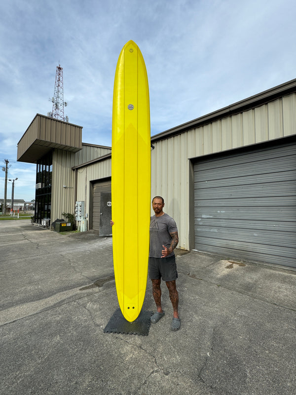 yellow glider surfboard