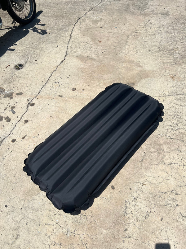 black inflatable surf mat