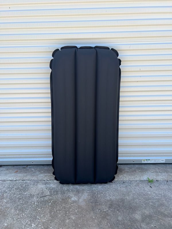 black inflatable surf mat