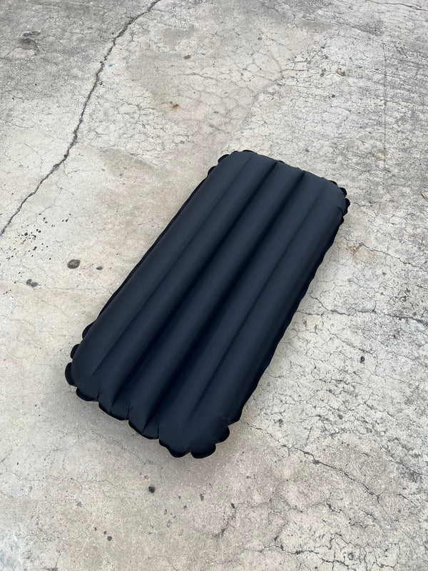 black and white inflatable surf mat