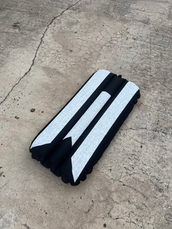black and white inflatable surf mat