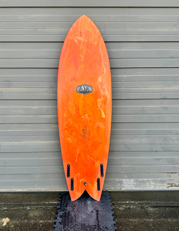 orange twin fin fish surfboard