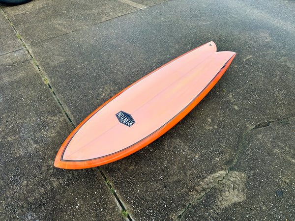 orange twin fin fish surfboard
