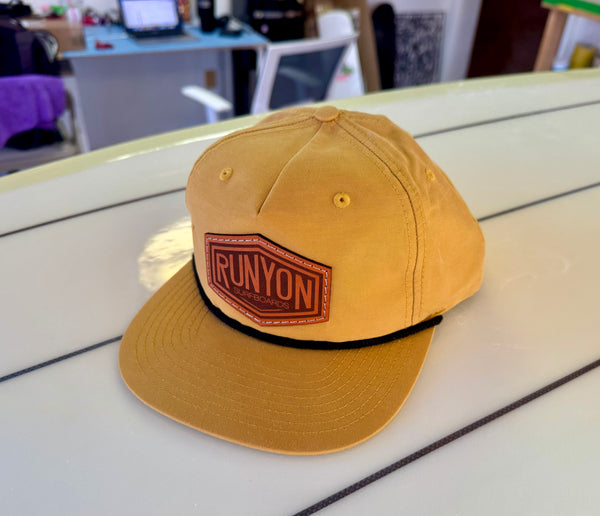 yellow hat with leather patch logo