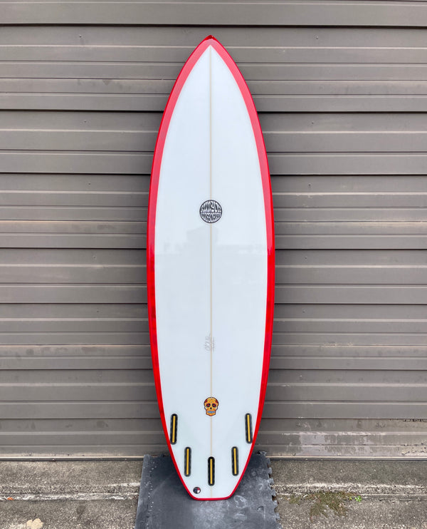 red and white 5 fin surfboard shortboard
