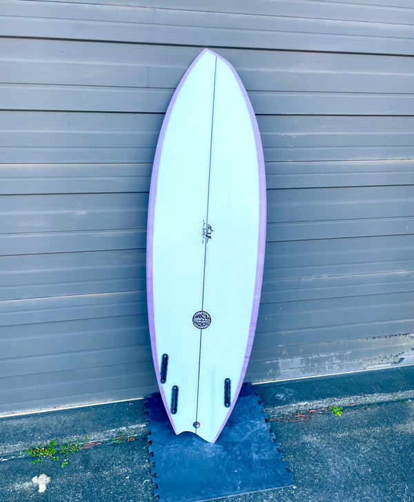purple and white shortboard surfboard