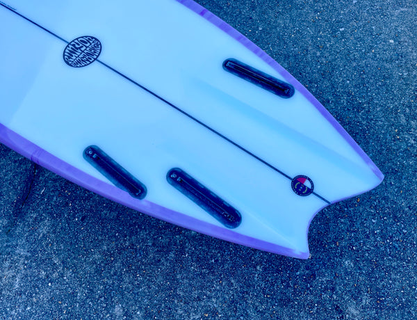 purple and white shortboard surfboard