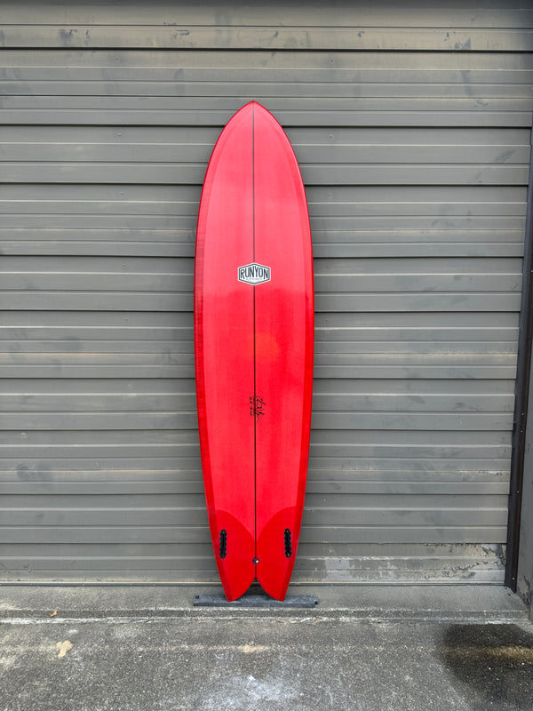 red mid length fish surfboard