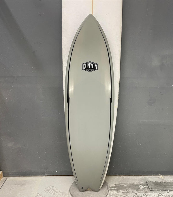 grey shortboard swallow tail surfboard