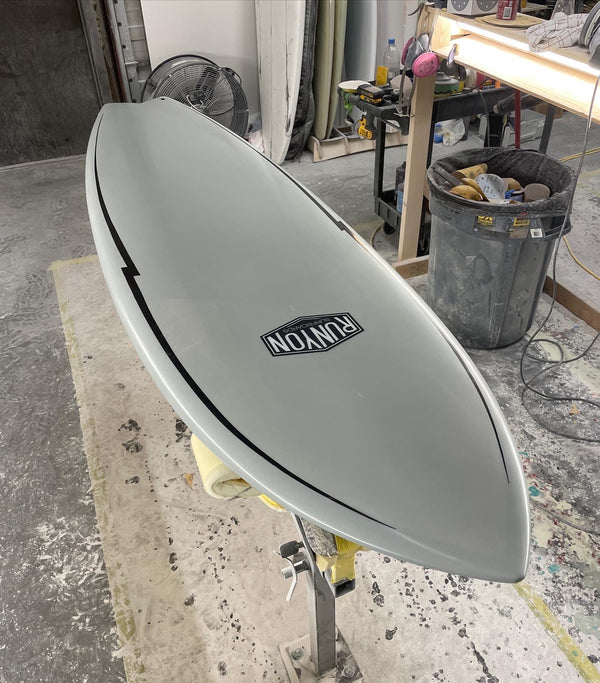white shortboard swallow tail surfboard