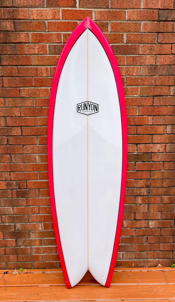 red and white twin fin fish surfboard