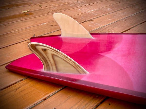 Close up on the King Fish Surfboard Tail. Faux wood, glassed in twin-fin, fin setup.