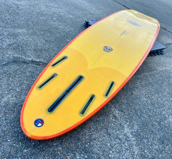 yellow 5 fin longboard surfboard