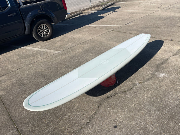 white single fin longboard