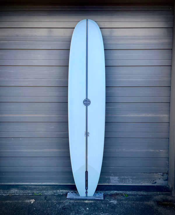 white single fin longboard