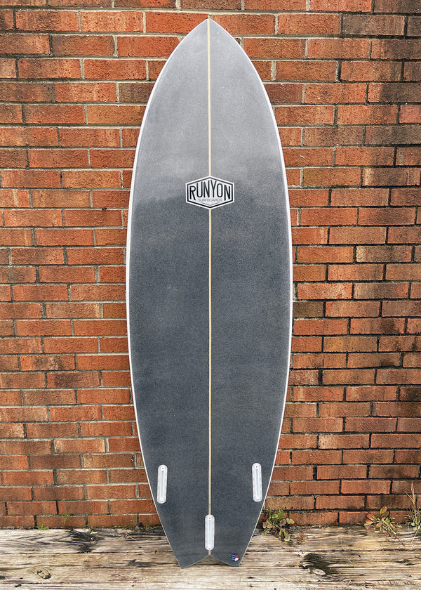 black shortboard swallow tail surfboard