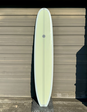 green and white longboard surfboard