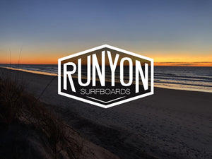 The image showcases the Runyon Surfboards logo against a scenic beach sunset backdrop, highlighting the brand's surfing heritage.