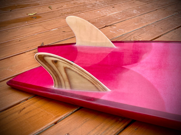 Close up on the King Fish Surfboard Tail. Faux wood, glassed in twin-fin, fin setup. 