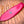 Rouge King Fish Surfboard laying on a wooden deck. Runyon logo in the center. Fish Shaped design. 