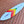 white and multi colored mid length swallow tail surfboard