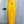 yellow mid length swallow tail surfboard